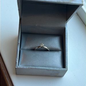 Size 7 RGC 14k White diamond ring. Unsure of brand or carat size.
